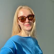 Rosalie, founder of Inclusive Islanders, smiling in the sunshine